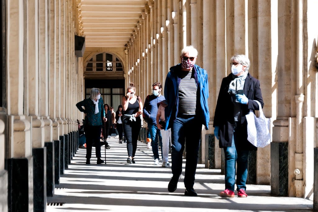 Masked tourists near Palais Royal, Paris (Getty Images)