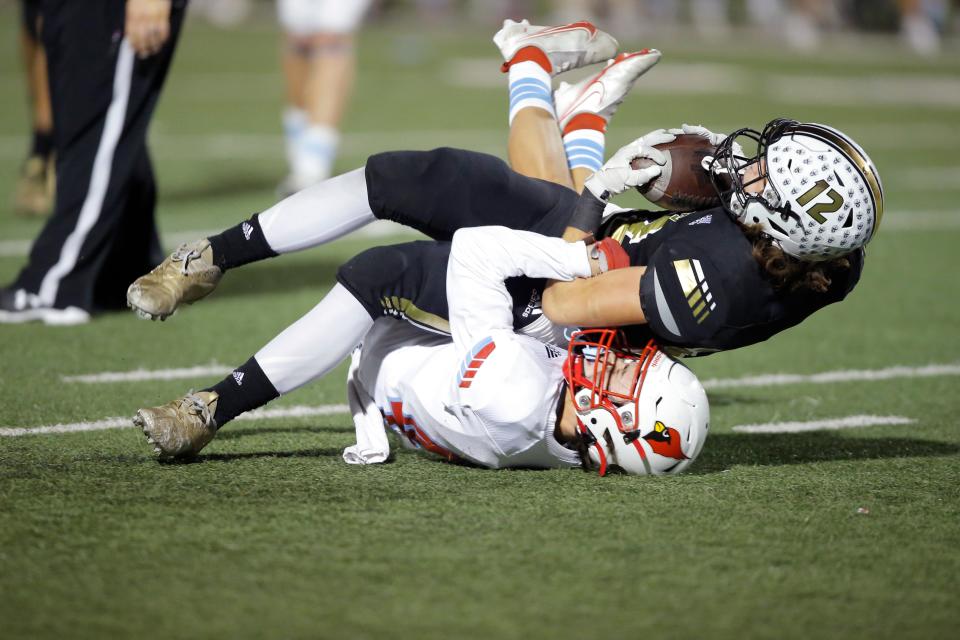 Collinsville's Hudson Henslick brings dow McAlester's Racer Harkins during the Class 5A state championship football game between McAlester and Collinsville at Chad Richison at the University of Central Oklahoma in Edmond, Okla., Saturday, Dec. 4, 2021.