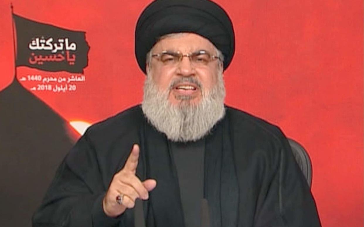 Hassan Nasrallah, the head of Lebanon's militant Shia movement Hizbollah, giving a televised address from an undisclosed location in Lebanon. - AFP