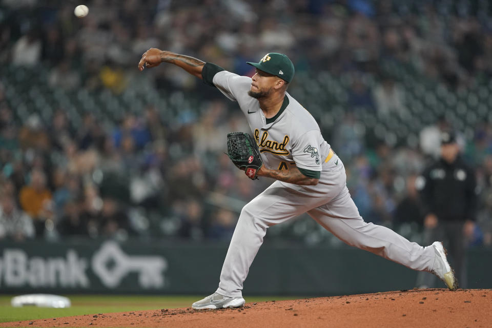 Oakland Athletics starting pitcher Frankie Montas throws against the Seattle Mariners during the first inning of a baseball game, Sunday, July 3, 2022, in Seattle. (AP Photo/Ted S. Warren)