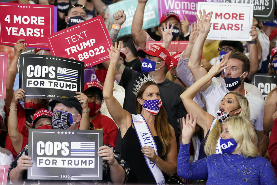 Supporters cheer as President Donald Trump speaks at a rally at Xtreme Manufacturing, Sunday, Sept. 13, 2020, in Henderson, Nev. (AP Photo/Andrew Harnik)