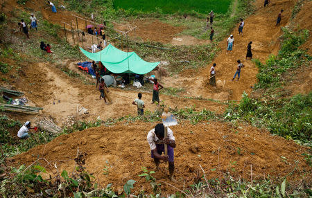 Rohingya refugees cut hill to make their makeshift shelter near Balukhali in Cox’s Bazar, Bangladesh, September 4, 2017. REUTERS/Mohammad Ponir Hossain