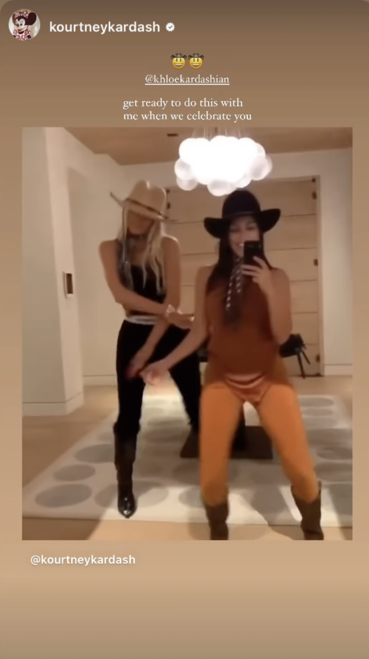 Kourtney Kardashian and another person in cowboy hats and dance attire doing a dance routine in a room with a white ceiling light. Text: 