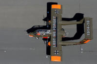 An OV-10 Bronco aircraft, decorated with World War One commemoration motifs, lands at Flanders international airport, ahead of the world's first Short Take Off & Landing competition on sand, in Wevelgem, Belgium May 8, 2018. REUTERS/Francois Lenoir