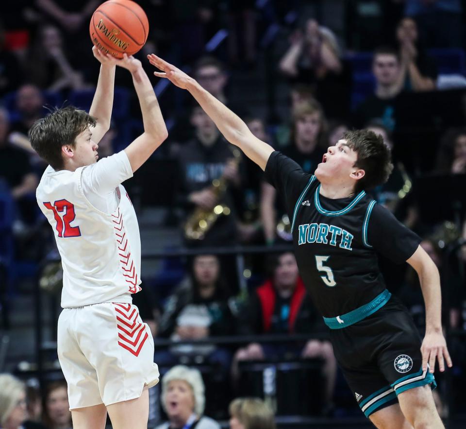 Lincoln County's Evan Smith shoots over North Oldham's Jack Scales in the first half of Friday's boys Sweet 16. March 18, 2022