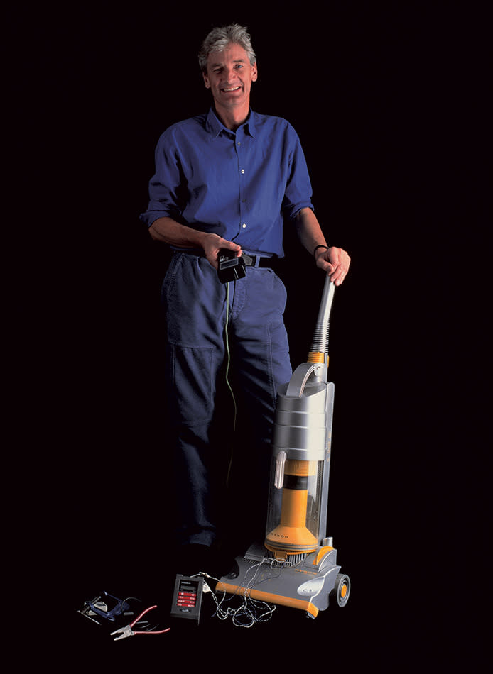 James Dyson and the first Dyson vacuum cleaner, the DC01.