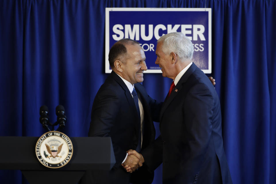 Vice President Mike Pence, right, shakes hands with Rep. Lloyd Smucker, R-Pa., during a campaign event in Lititz, Pa., Wednesday, Oct. 24, 2018. (AP Photo/Matt Rourke)