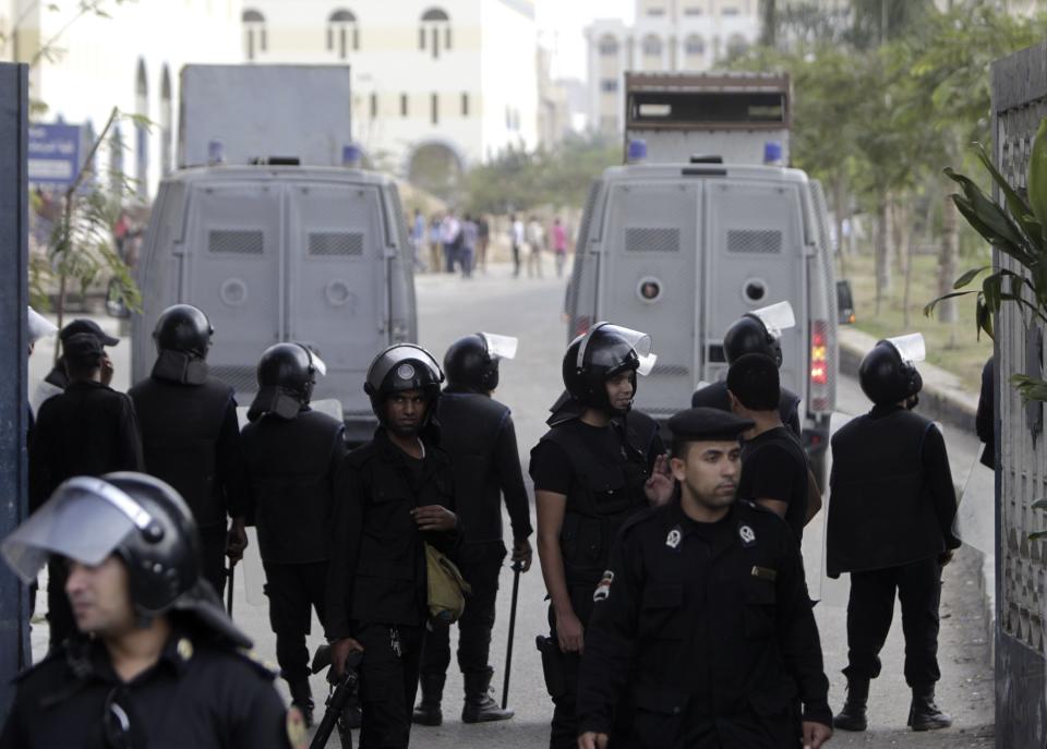 Riot police maintain order on al-Azhar university campus after clashes broke out during student protests in Cairo October 30, 2013. Egyptian police fired teargas at protesting students at Cairo's al-Azhar university on Wednesday hours after authorities announced the detention of Muslim Brotherhood leader Essam El-Erian, part of a crackdown against the Islamist movement. (REUTERS/Mohamed Abd El Ghany)