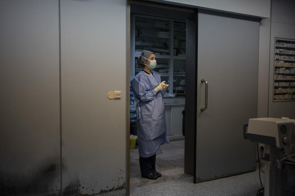Nurse Martina Pavanic, of the Novick Cardiac Alliance medical team, stands in the operating room before a surgery at the Tajoura National Heart Center in Tripoli, Libya, on Feb. 24, 2020. (AP Photo/Felipe Dana)