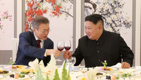 FILE PHOTO: South Korean President Moon Jae-in makes a toast with North Korean leader Kim Jong Un during a luncheon at Samjiyon Guesthouse in Ryanggang province, North Korea, September 20, 2018. Pyeongyang Press Corps/Pool via REUTERS