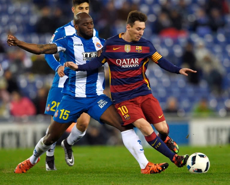 Barcelona's forward Lionel Messi (R) vies with Espanyol's defender Michael Ciani (L) during the Spanish Copa del Rey round of 16 second leg football match at Cornella-El Prat stadium in Cornella near Barcelona, on January 13, 2016