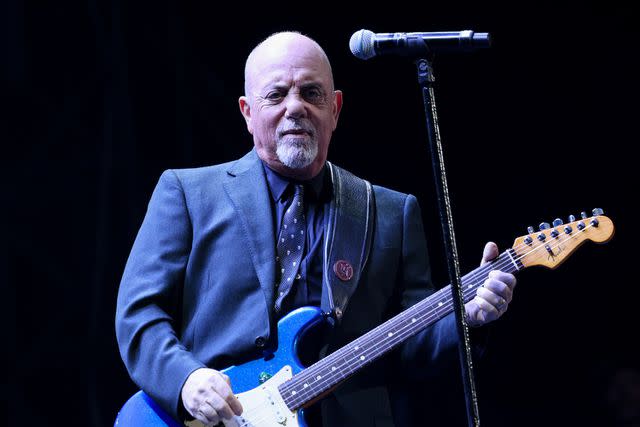 <p>Dave Simpson/Getty</p> Billy Joel performing in December 2022