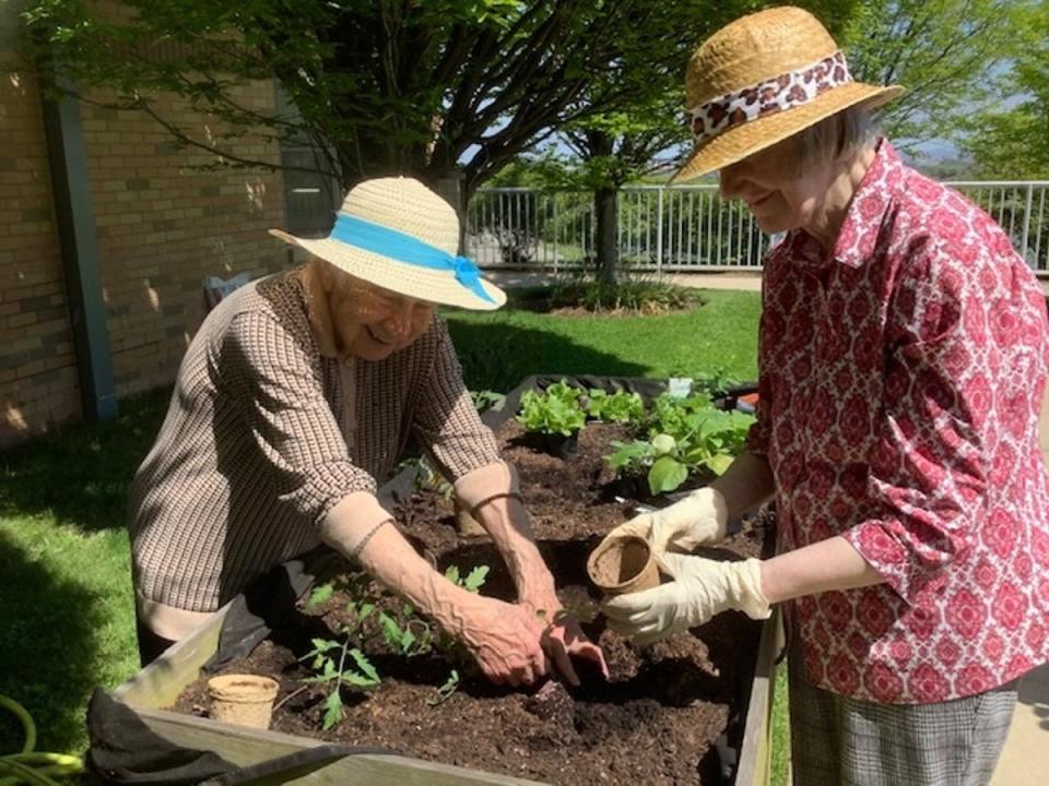 Sisters Eleanor Maragliano and Anne Collins, members of Sisters of St Joseph of Peace, working in their garden. The median age of the Sisters is 83 and their investment portfolio helps take care of their elderly members and fund missionary work (Courtesy of Sisters of St Joseph of Peace)
