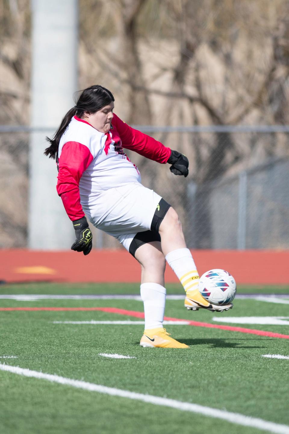 Pueblo East's Alexis Sisneros clears the ball during a matchup with Rye on March 28.