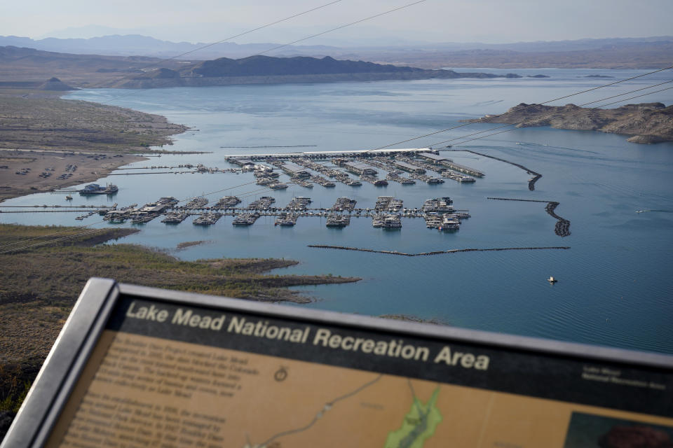 Boats fill slips at a marina on Lake Mead at the Lake Mead National Recreation Area, Thursday, Aug. 13, 2020, near Boulder City, Nev. The U.S. Bureau of Reclamation is expected to release projections that suggest the levels in Lake Powell and Lake Mead dipped slightly compared with last year. (AP Photo/John Locher)