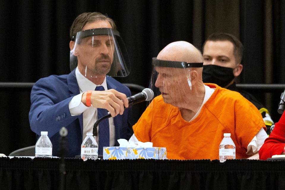 Joseph Cress, left, the public defender for Joseph James DeAngelo, charged with being the Golden State Killer, adjusts the microphone for his client during a hearing in Sacramento Superior Court in Sacramento, Calif. Monday June 29, 2020.