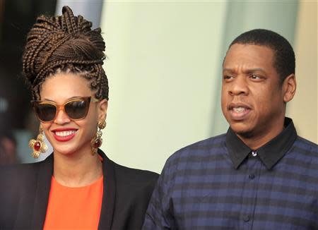 U.S. singer Beyonce (L) and her husband rapper Jay-Z walk as they leave their hotel in Havana in this April 4, 2013 file photo. REUTERS/Enrique De La Osa/Files