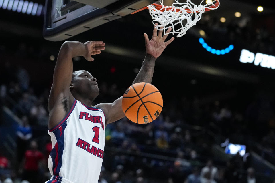 Florida Atlantic guard Johnell Davis (1) gets a basket on a dunk against Fairleigh Dickinson in the second half of a second-round college basketball game in the men's NCAA Tournament in Columbus, Ohio, Sunday, March 19, 2023. Florida Atlantic defeated Fairleigh Dickinson 78-70. (AP Photo/Michael Conroy)