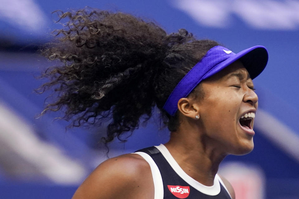 FILE - In this Sept. 12, 2020, file photo, Naomi Osaka, of Japan, reacts during the women's singles final against Victoria Azarenka, of Belarus, during the U.S. Open tennis tournament in New York. Osaka has been selected by The Associated Press as the Female Athlete of the Year. (AP Photo/Seth Wenig, File)