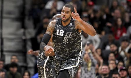 Nov 10, 2018; San Antonio, TX, USA; San Antonio Spurs forward LaMarcus Aldridge (12) reacts after making a basket during the fourth quarter against the Houston Rockets at AT&T Center. John Glaser-USA TODAY Sports