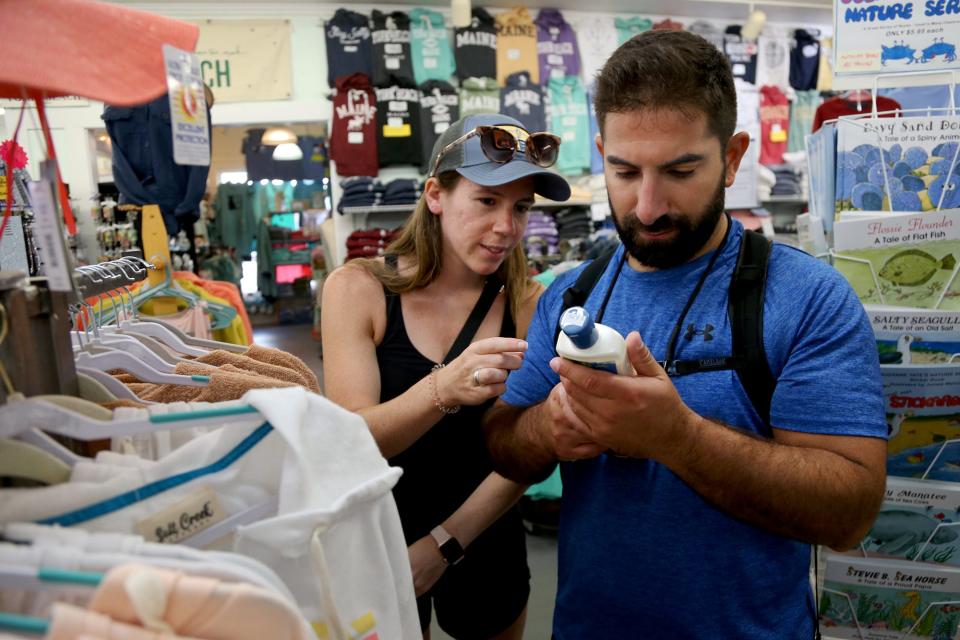 From left, Dakota Howe and Marco DiCarlo buy sunscreen at a shop downtown in York on Tuesday, August 30, 2022.