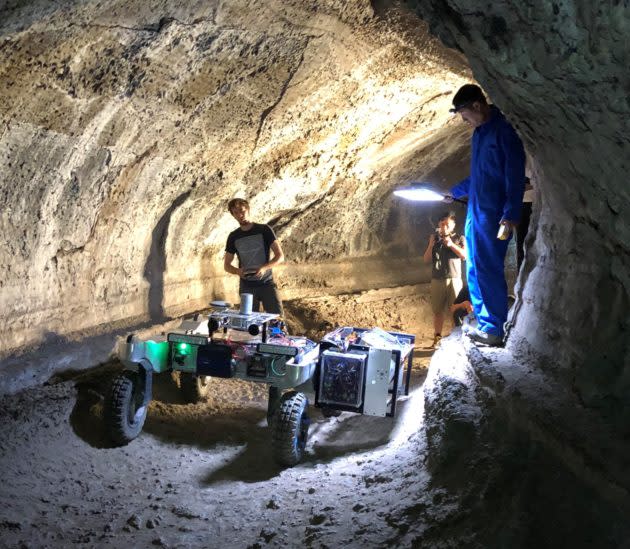 A NASA robotics team drives a test rover into Valentine Cave at California’s Lava Beds National Monument. The expedition was aimed at testing technologies for exploring lava tubes on the moon and Mars. (NASA Photo)