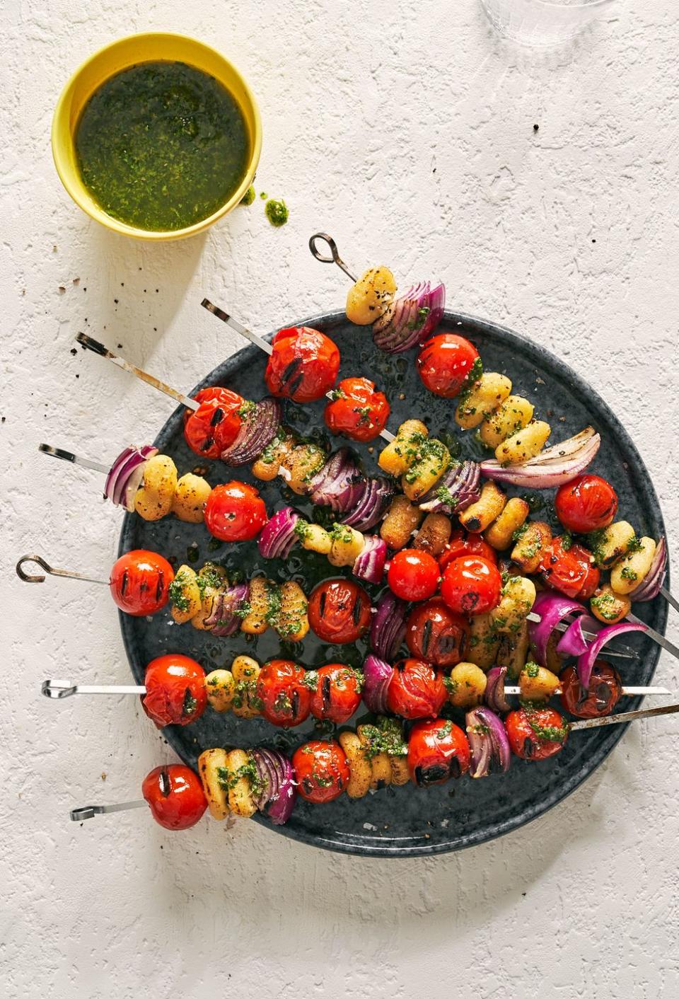 tomato gnocchi kebabs with red onion and salsa verde