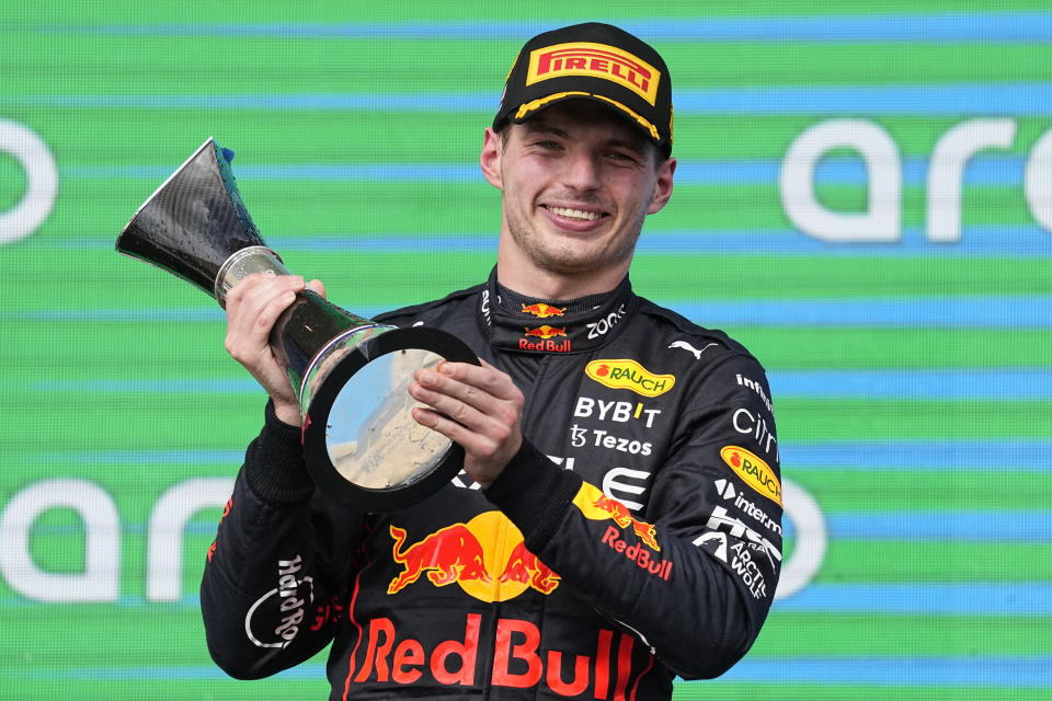 Red Bull driver Max Verstappen, of the Netherlands, raises the trophy after winning the Formula One U.S. Grand Prix auto race at Circuit of the Americas, Sunday, Oct. 23, 2022, in Austin, Texas. (AP Photo/Charlie Neibergall)