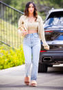 <p>Megan Fox looks gorgeous as she steps out in a cropped top, sweater and jeans while out in L.A. on Thursday.</p>