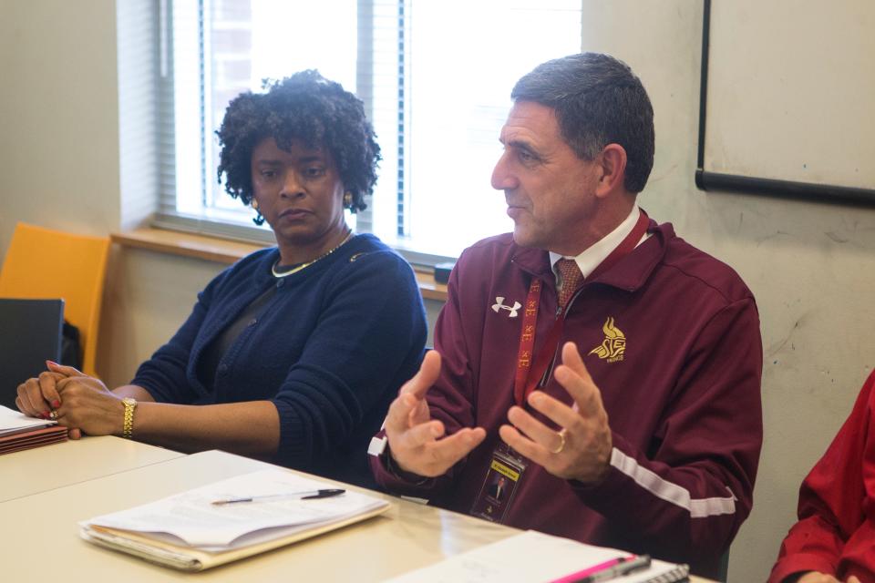 Once Wilmington City Treasurer Velda Jones Potter, left, listens to then-President and Athletic Director of St. Elizabeth High School Joseph Papili during a meeting of the Canby Park Working Group Monday, Feb. 12, 2018, at the Woodlawn Library.