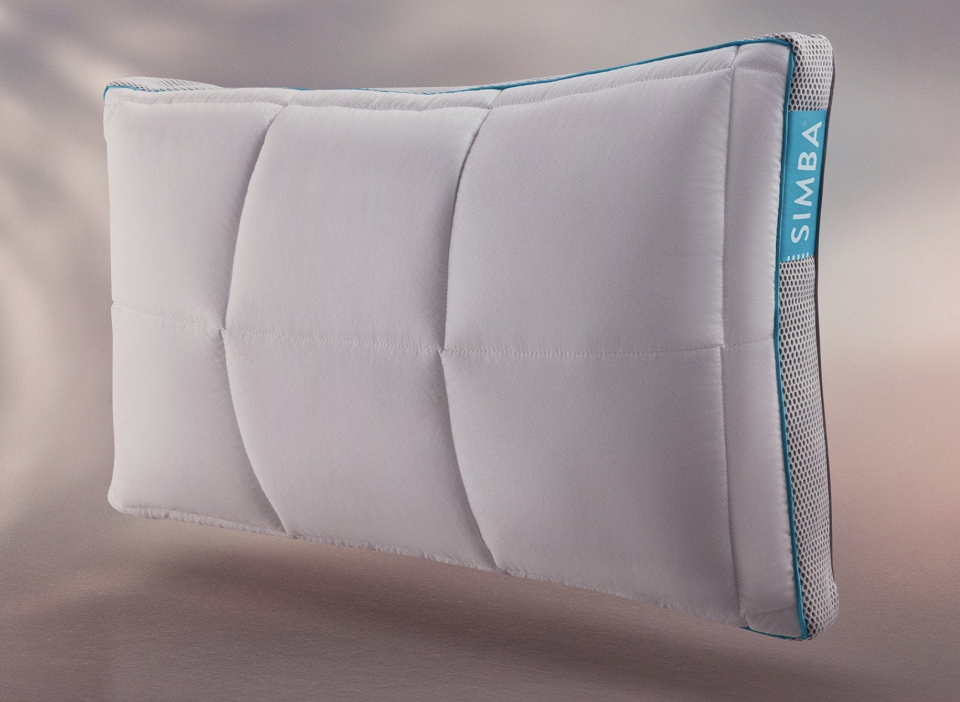 Simba Hybrid Pillow with blue and white stitching (Photo via Simba Sleep)