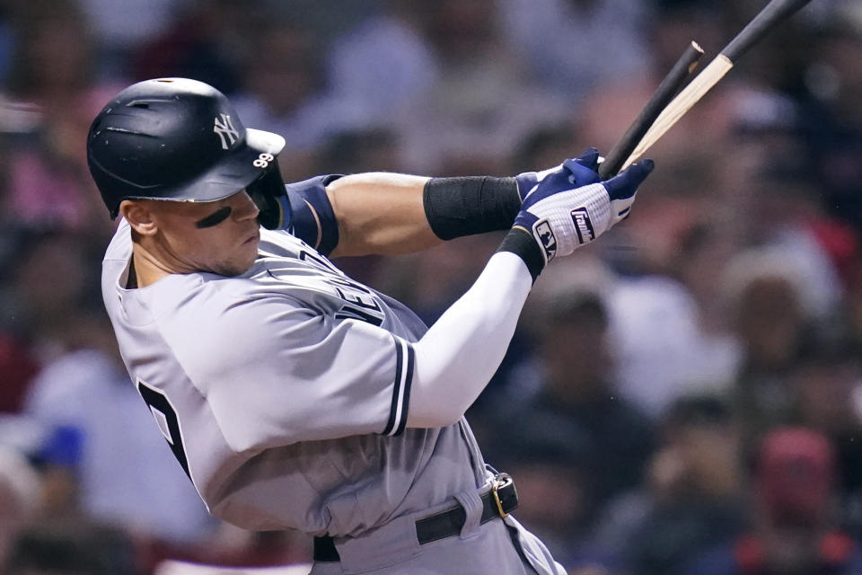 New York Yankees' Aaron Judge breaks his bat on a single during the fifth inning of a baseball game against the Boston Red Sox at Fenway Park, Wednesday, Sept. 14, 2022, in Boston. (AP Photo/Charles Krupa)