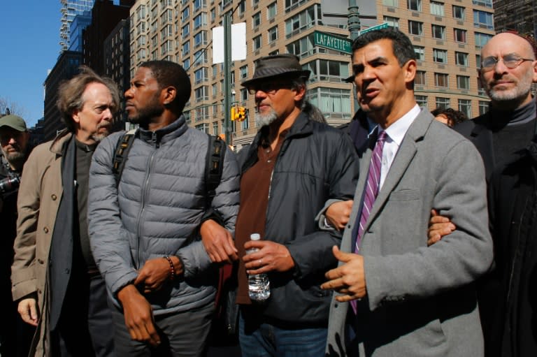 Ravi Ragbir (C), City Council Members Jumaane Williams (L) and Ydanis Rodriguez (R) exit from an immigration court hearing and speaking at a rally to show solidarity with individuals affected by deportation March 9, 2017 in New York