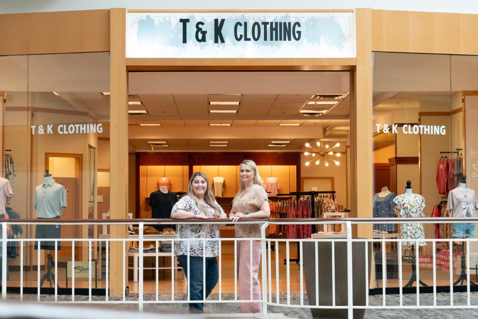T&K Clothing owners Kayla Brown, left, and her mother Tonya Brown stand in front of their new store at West Ridge Mall last week. The store, which was the former Christopher and Banks just south of Zumiez, carries men's and women's clothing from sizes small to 3XL.