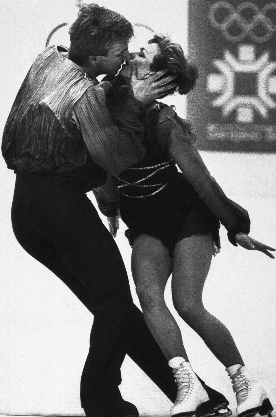 FILE - Britain's Jayne Torvill and Christopher Dean kiss during their performance in Olympic ice dancing at the Winter Olympics in Sarajevo, Bosnia, Feb. 14, 1984. (AP Photo/File)