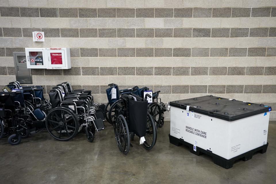 Supplies are staged as members of the Texas Army National Guard set up a field hospital in response to the new coronavirus pandemic at the Kay Bailey Hutchison Convention Center on Tuesday, March 31, 2020, in Dallas. (Smiley N. Pool/The Dallas Morning News via AP, Pool)