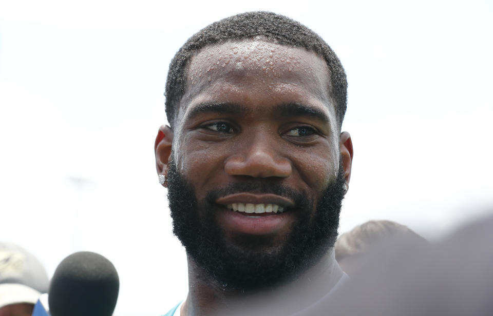 Miami Dolphins cornerback Xavien Howard (25) speaks to the media during an NFL organized team activities football practice on Tuesday, May 14, 2019, in Davie, Fla. (AP Photo/Brynn Anderson)