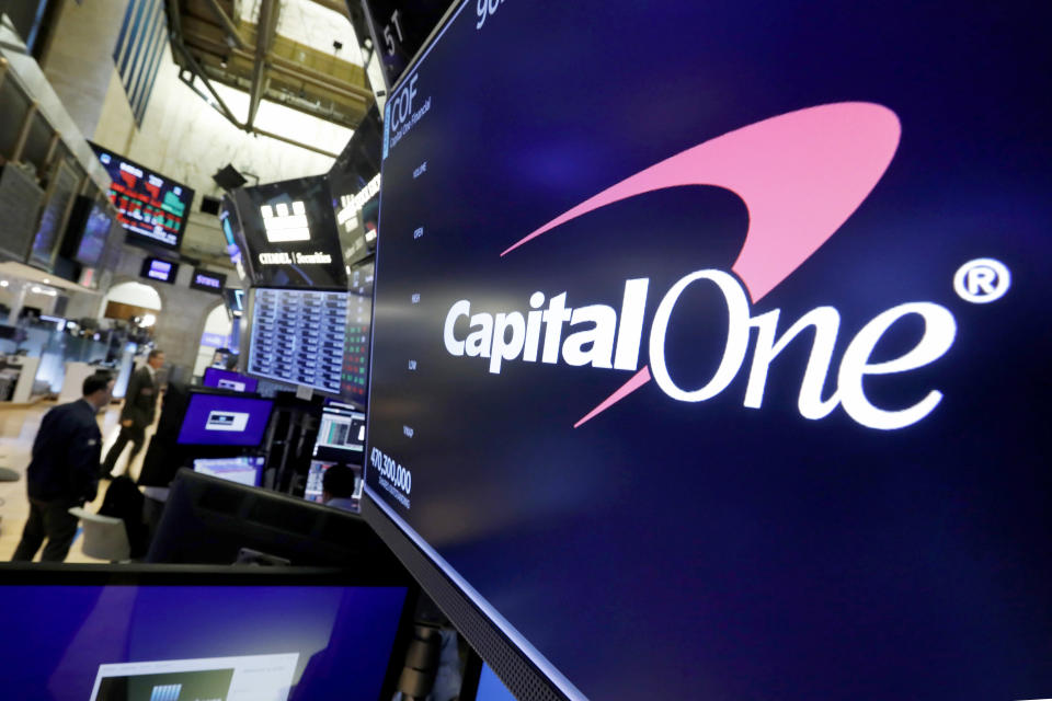 FILE - The logo for Capital One Financial is displayed above a trading post on the floor of the New York Stock Exchange, July 30, 2019. Capital One Financial is buying Discover Financial Services for $35 billion, in a deal that would bring together two of the nation's biggest lenders and credit card issuers, according to a news release issued by the companies Monday, Feb. 19, 2024. (AP Photo/Richard Drew, File)