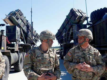 FILE PHOTO: U.S. soldiers stand next to the long-range air defence system Patriot during Toburq Legacy 2017 air defence exercise in the military airfield near Siauliai, Lithuania, July 20, 2017. REUTERS/Ints Kalnins/File Photo