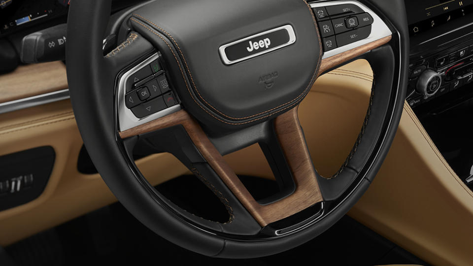 2021 Jeep® Grand Cherokee L Summit Reserve features an all-new leather-wrapped multifunction steering wheel with Waxed Walnut wood accents.