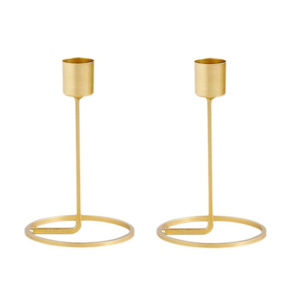 Look: Their dinner table (or mantel—or bathroom shelf) just got so modern. <a rel="nofollow noopener" href="https://www.amazon.com/Yunhigh-Candlestick-Candles-Decorative-Centerpiece/dp/B07G98M8WZ/" target="_blank" data-ylk="slk:SHOP NOW;elm:context_link;itc:0;sec:content-canvas" class="link ">SHOP NOW</a>: Candlestick Holders by Yunhigh, $10