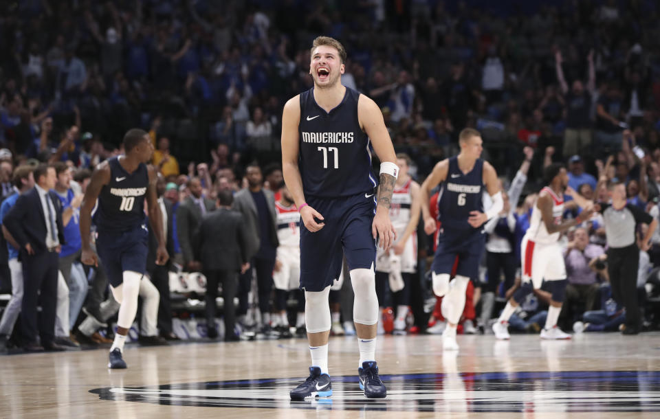 Luka Doncic was all smiles after a big night playing next to Kristaps Porzingis. (Kevin Jairaj/Reuters)