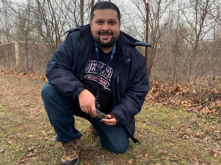 Photo of Roberto Vargas holding a meteorite he found in January