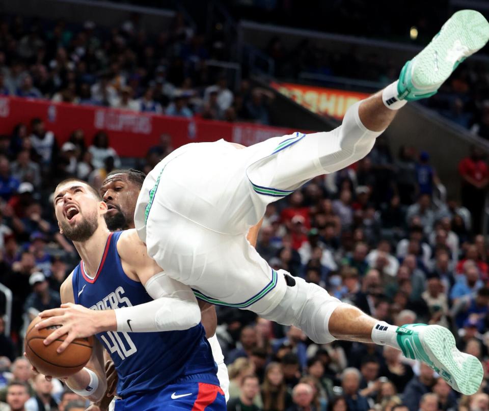 Ivica Zubac is fouled by a Minnesota player.