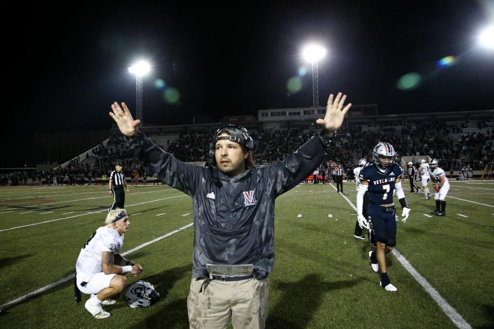 Veterans Memorial head football coach Ben Bitner tells the team not to rush the field during the final second of the playoff game against PSJA North on Saturday, Dec. 3, 2022 at Buccaneer Stadium.