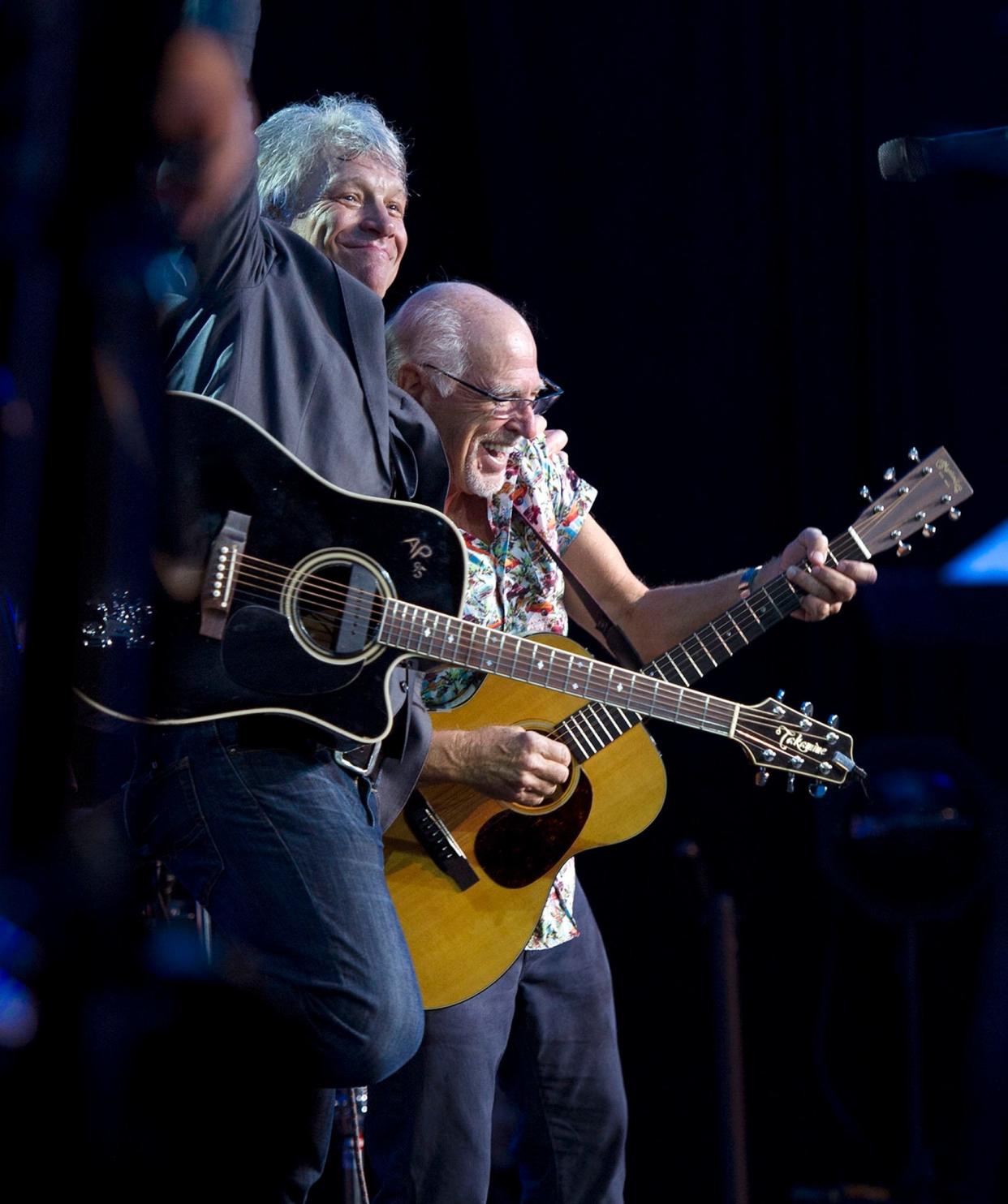 Singers Jon Bon Jovi and Jimmy Buffett perform during the Everglades Foundation's For Everglades dinner dance at The Breakers in February 2019. Buffett died of cancer Friday at 76.