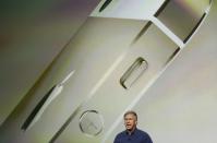 Phil Schiller, senior vice president of worldwide marketing for Apple Inc, talks about the new iPhone 5S at Apple Inc's media event in Cupertino, California September 10, 2013. REUTERS/Stephen Lam (UNITED STATES - Tags: BUSINESS SCIENCE TECHNOLOGY BUSINESS TELECOMS)