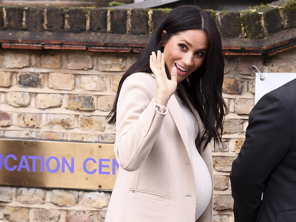 The Duchess of Sussex showcased her growing baby bump in a H&M dress for a trip to Mayhew in London [Photo: Getty]