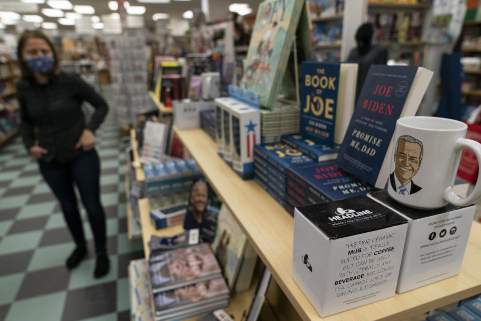 A display of President-elect Joe Biden and Jill Biden books and keepsakes are available at Browseabout Books, Friday, Nov. 13, 2020, in Rehoboth Beach, Del. President-elect Joe Biden owns a $2.7 million, Delaware North Shores home with a swimming pool that overlooks Cape Henlopen State Park, is blocks from the ocean and a short drive from downtown Rehoboth Beach.(AP Photo/Alex Brandon)