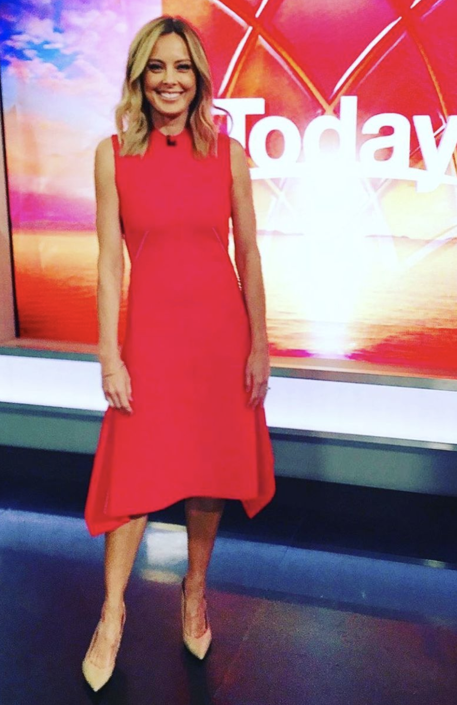 Allison Langdon wearing a red dress